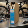 SHIMANO OT-SP41 Schaltzugaußenhülle 4mm 50m Schwarz für schnelle, präzise Schaltperformance im Fahrrad-Workshop.