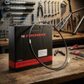 PROMAX Schalthüllenbox schwarz 30m mit SP-40 Gleithülle für Fahrradschaltung auf Werkbank.