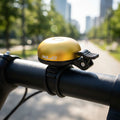 XLC Fahrradklingel DD-M29 gelb am Fahrradlenker montiert.