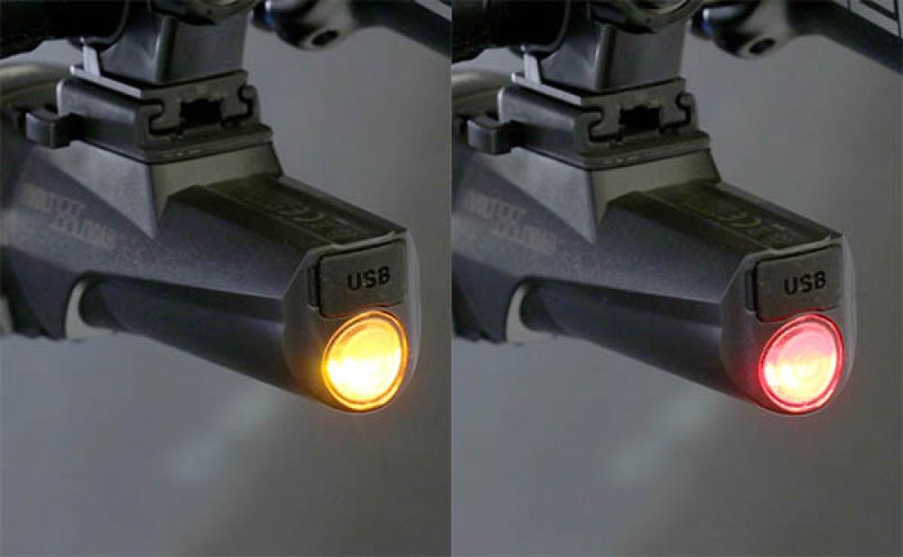 Cat Eye GVolt 100 StVZO Fahrradbeleuchtung schwarz, USB-aufladbar, zeigt gelbes Frontlicht & rotes Rücklicht.