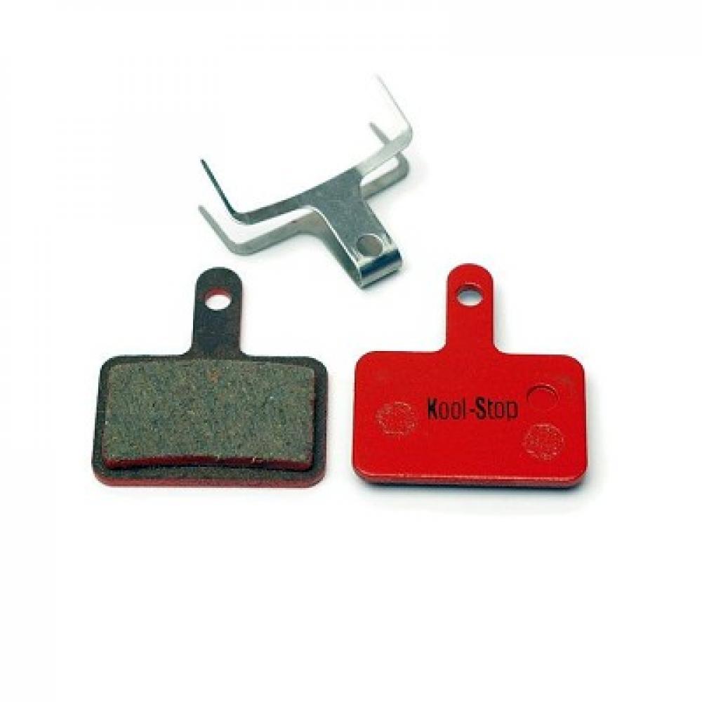 Kool Stop Scheibenbremsbelag D-620 für Fahrräder, mit rotem und grauem Bremsbelag sowie Spreizfeder.