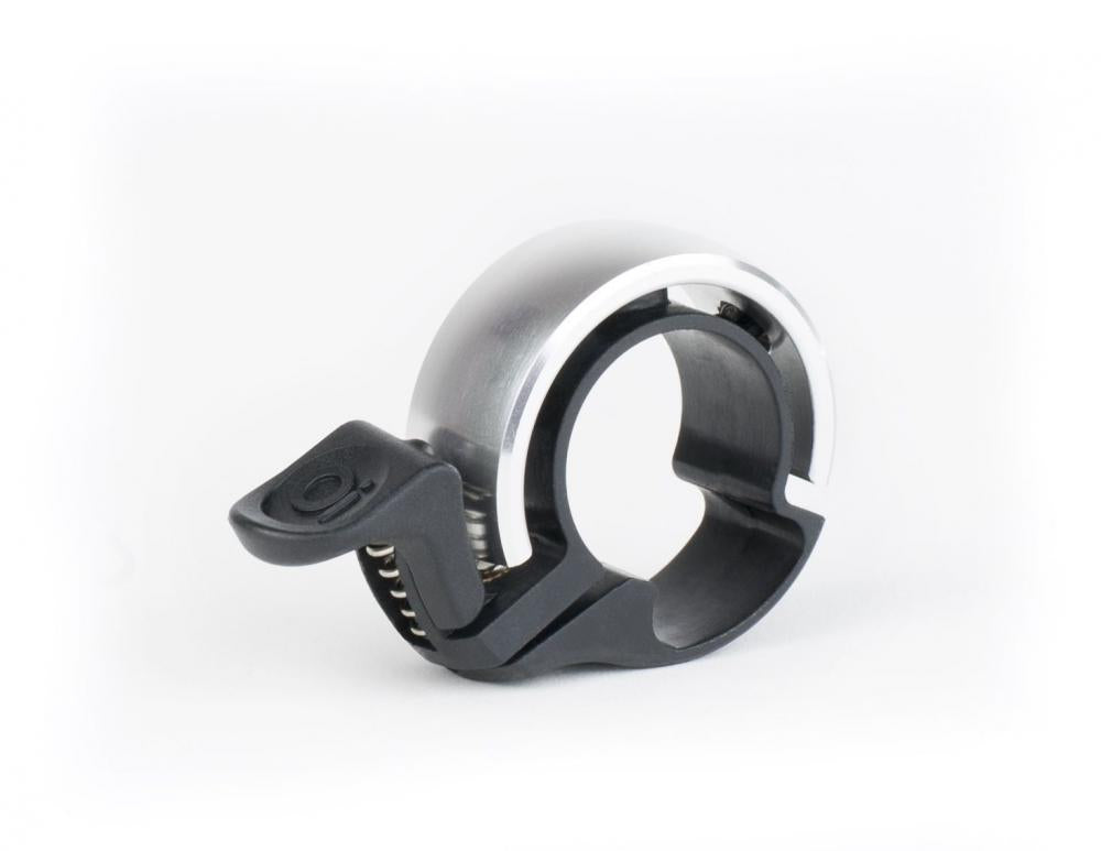Knog Fahrradklingel Oi Classic klein 22.2mm silber, elegante minimalistische Klingel.