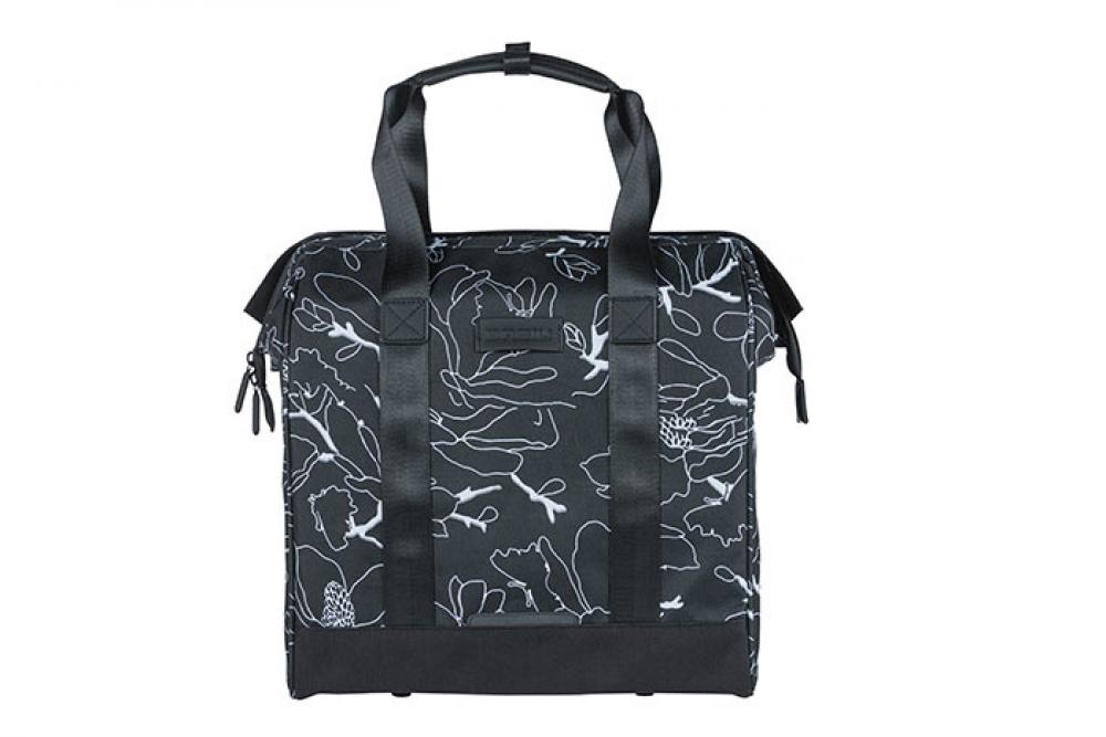 Schwarze Basil Shoppertasche Grand Flower mit weißen Blumenmuster und Hook On-System für Fahrrad.
