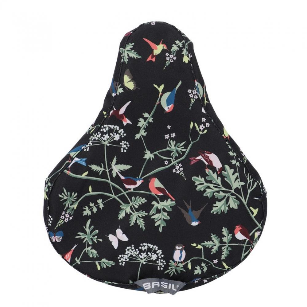 Basil Sattelüberzug Wanderlust charcoal mit buntem Vogel- und Blumenmuster für Fahrräder.