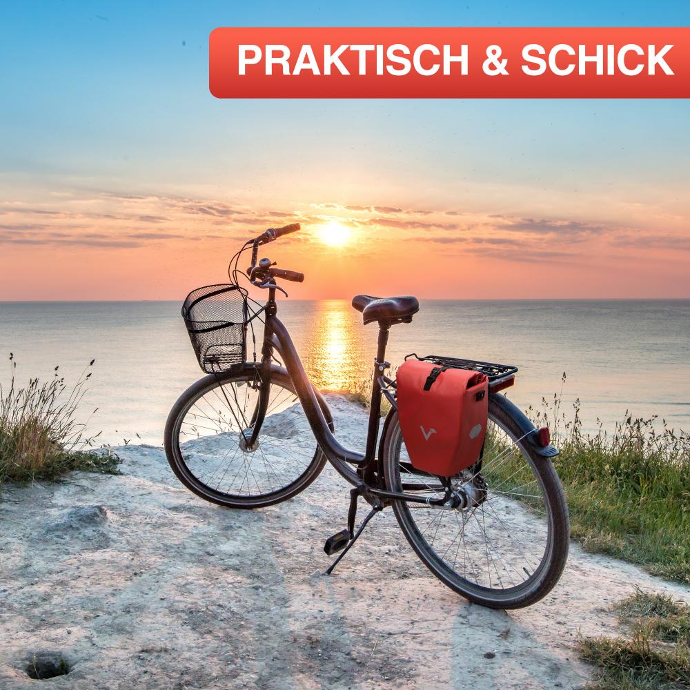 Rote Valkental Gepäckträgertasche 20L am Fahrrad, praktisch & schick, am Meer bei Sonnenuntergang.