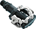 SHIMANO PD-M520 SPD-Pedal für MTB und Trekking, schwarz-silber mit Klickmechanismus und Logo.