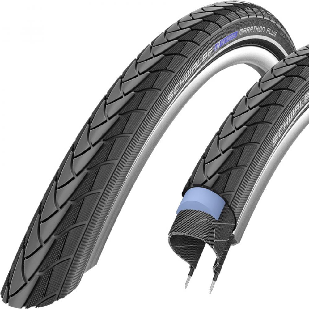 Zwei Schwalbe Marathon Plus E-25 Fahrradreifen, einer mit sichtbarem Pannenschutz.