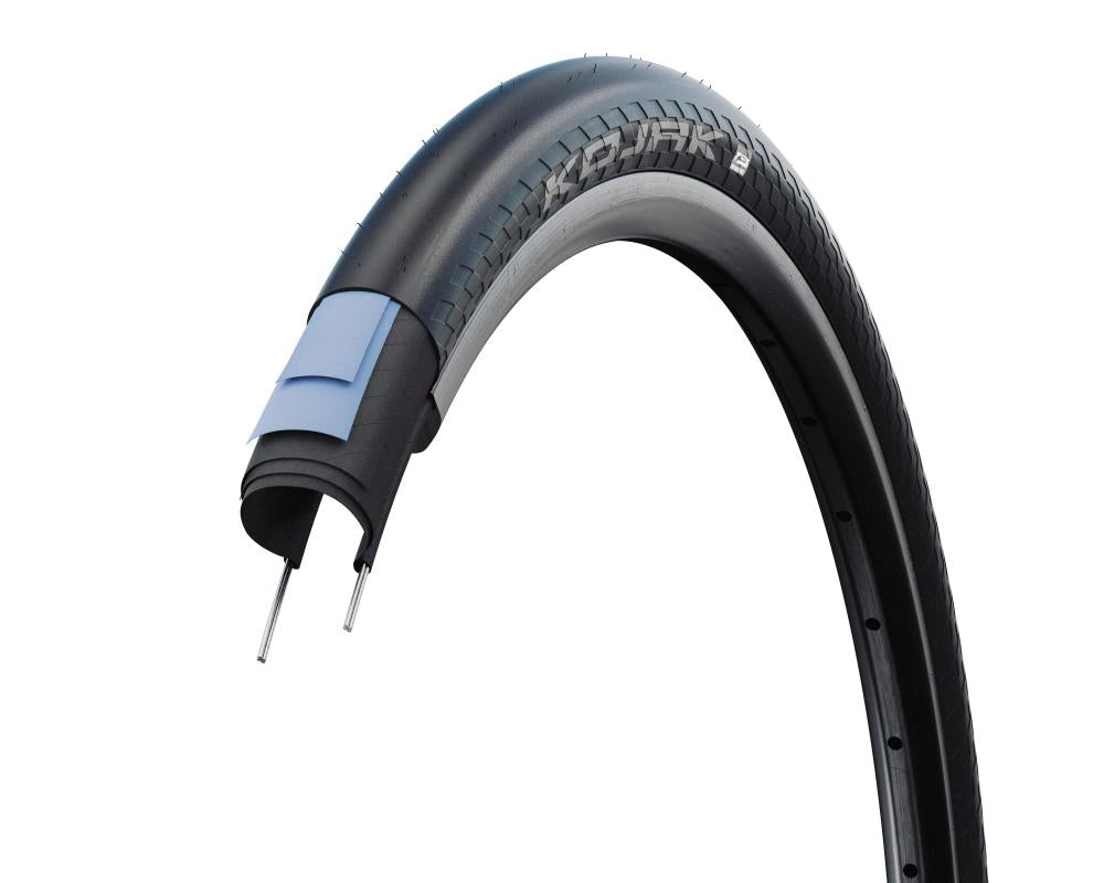 Schwalbe Kojak Reifen 26x2.00, Querschnitt zeigt RaceGuard Pannenschutz und Performance Line Aufbau.