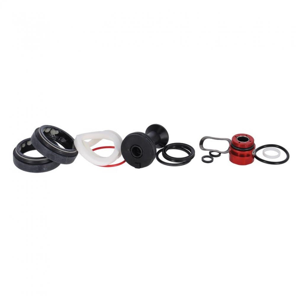 RockShox Federgabel Service-Kit Lyrik/Pike Einzelteile: Dichtungen, O-Ringe, rote und schwarze Bauteile auf Weiß.