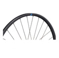 Ritchey WCS Zeta GX 27.5 Zoll Tubeless Ready Laufrad schwarz mit Speichen und blauem Logo auf der Felge.