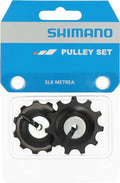 Shimano SLX RD-M7000 Schaltrollensatz mit zwei schwarzen Schalträdchen in originaler Blisterverpackung.