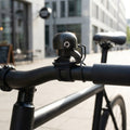 Procraft DIN-Dong Ultimate Fahrradklingel schwarz. Laute, stilvolle Klingel für sicheres Radfahren.