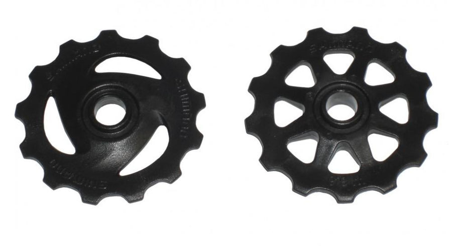 SHIMANO Schaltrollensatz RD-TX35 für Shimano Tourney Schaltwerke, zwei schwarze Schaltrollen.