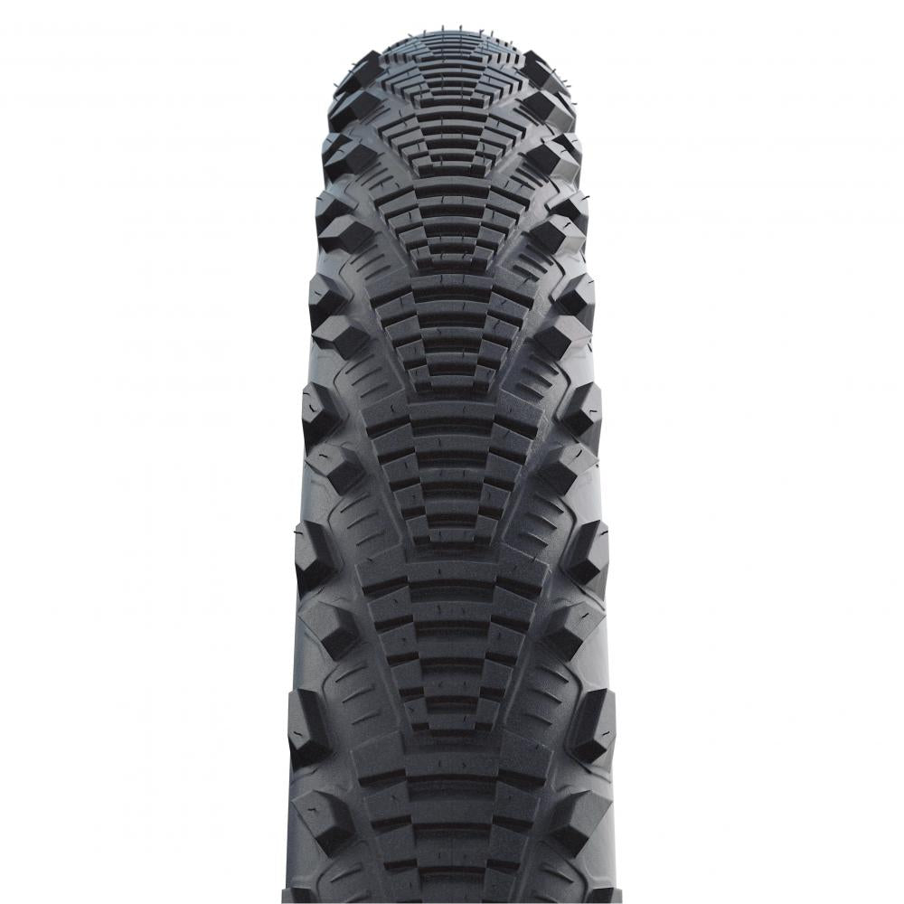 Schwalbe CX Comp 28x1.35 Fahrradreifen mit Semi-Slick Profil für Straße und leichtes Gelände in der Detailansicht.