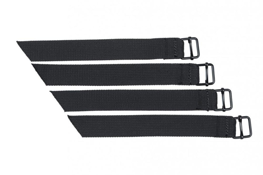 Basil UNIVERSAL BRIDGE SYSTEM STRAPS für Doppeltaschen, vier schwarze Gurte mit D-Ringen auf weißem Hintergrund.