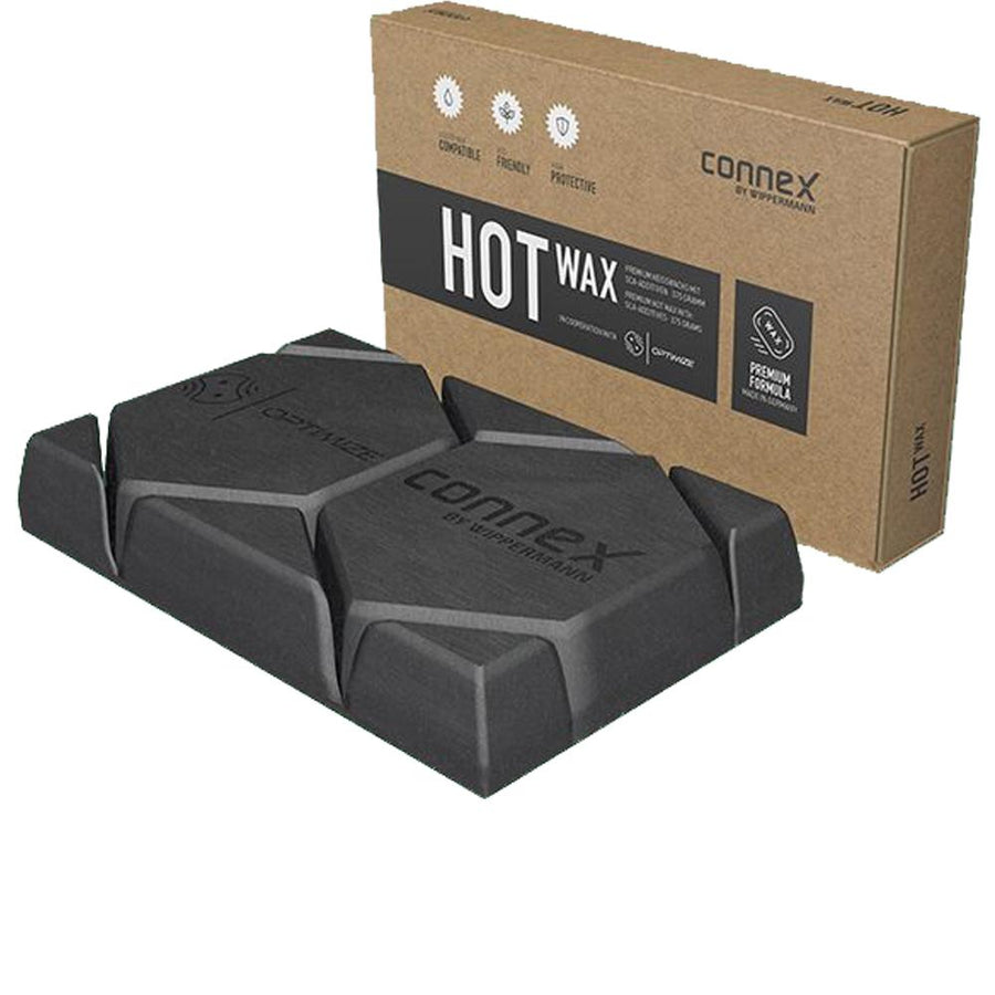 Connex Hot Wax Kettenwachs 375g: Schwarzer Wachsblock und braune Box für Fahrradketten-Pflege.