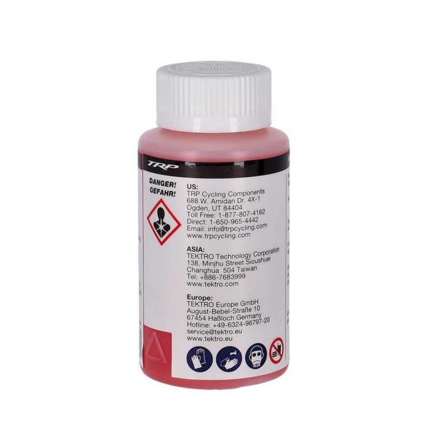 TRP Bremsflüssigkeit Mineralöl 100ml rot. Flasche mit weißem Deckel und Warnhinweisen auf dem Etikett.