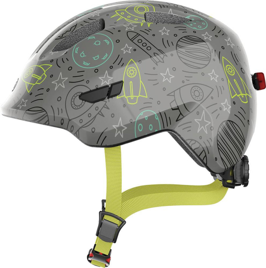 Abus Kinderhelm Smiley 3.0 LED grau mit Weltraumdesign: Raketen, Planeten, Sterne.