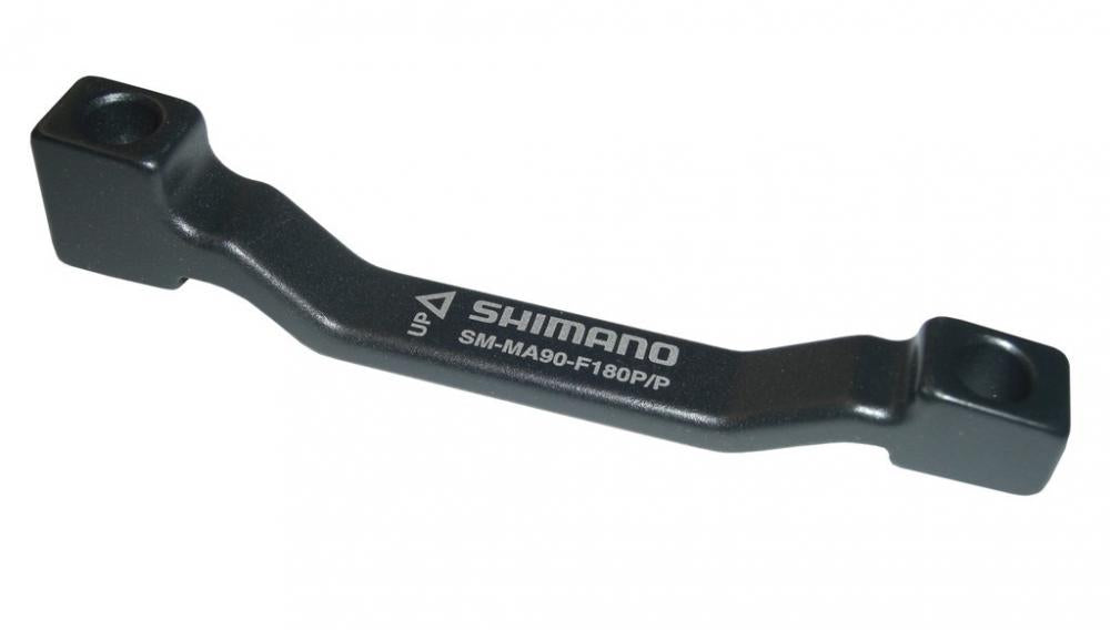 Schwarzer SHIMANO Fahrrad Scheibenbremsadapter PM PM 180mm für 180mm Rotor mit Schriftzug.