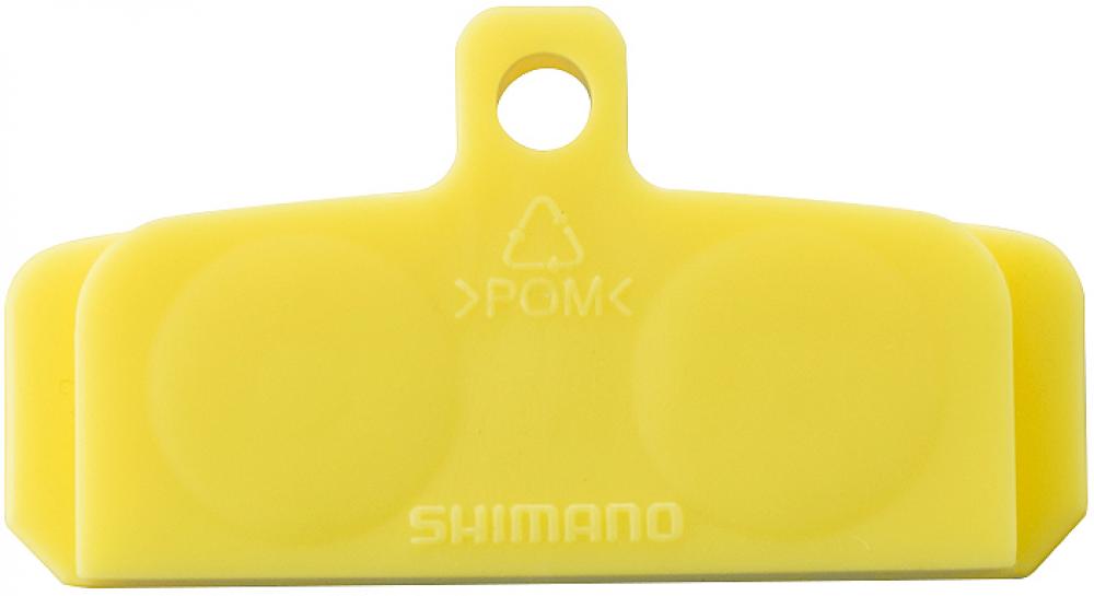 Gelber SHIMANO Entlüftungs Distanzhalter BR-M aus POM für Scheibenbremsen, Größe M.